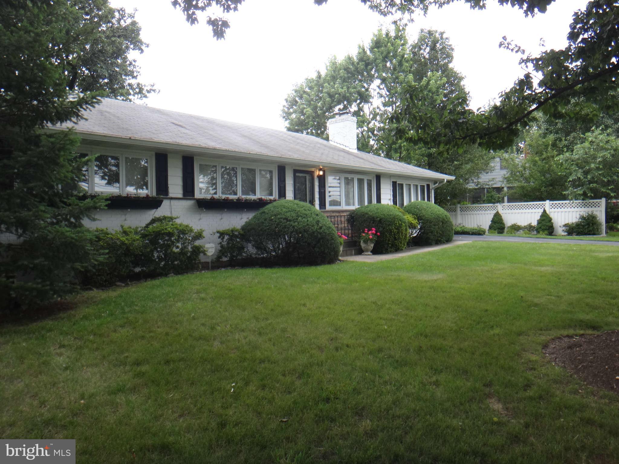 10128 Riggs Road Adelphi, MD 20783 - Photo 2 of 30 a view of a house with a yard and potted plants