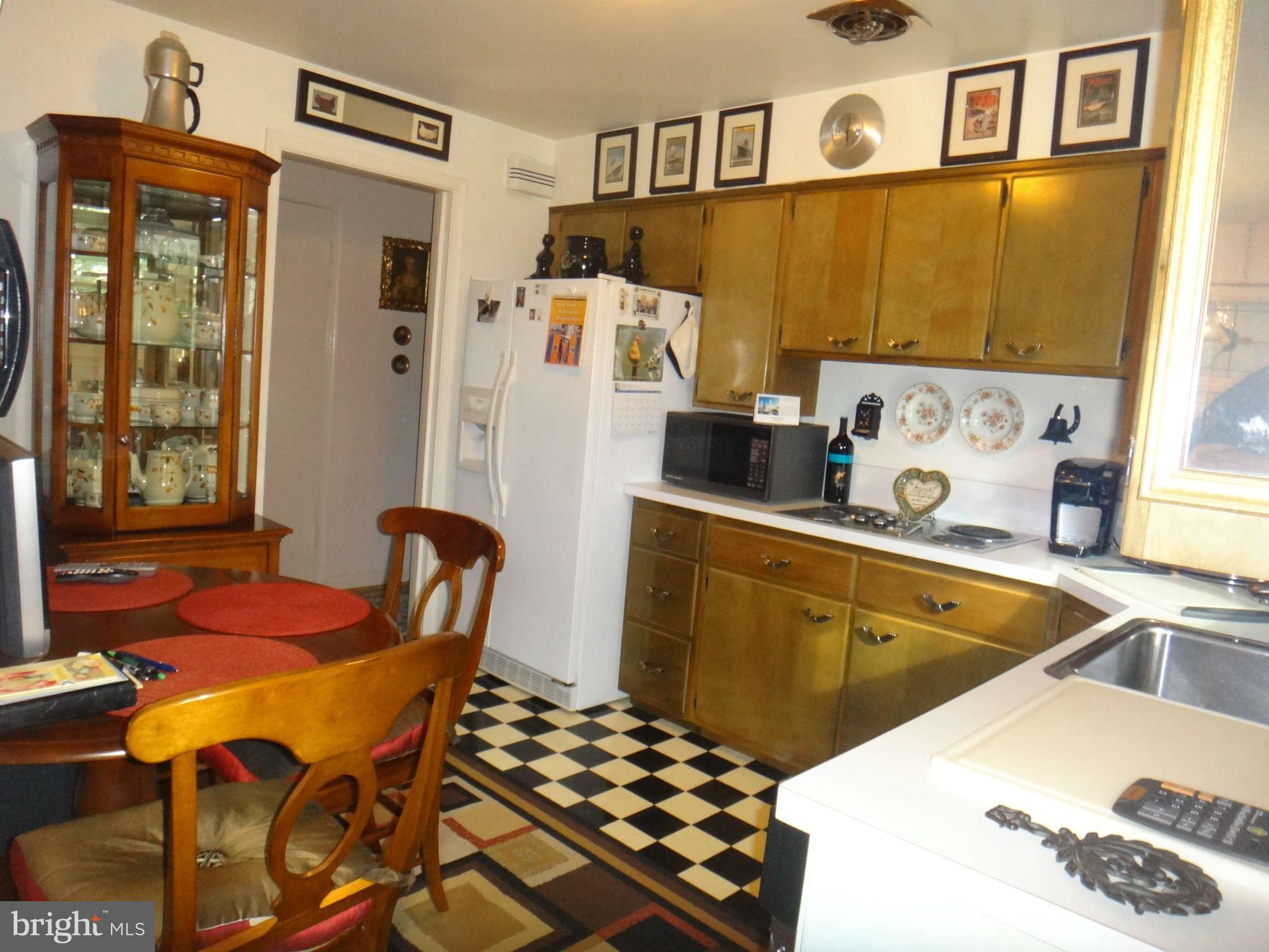10128 Riggs Road Adelphi, MD 20783 - Photo 12 of 30 a dining room with furniture and window