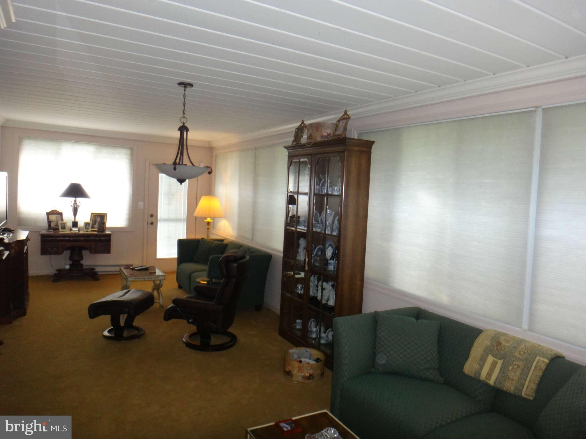 10128 Riggs Road Adelphi, MD 20783 - Photo 16 of 30 a livingroom with furniture and a window