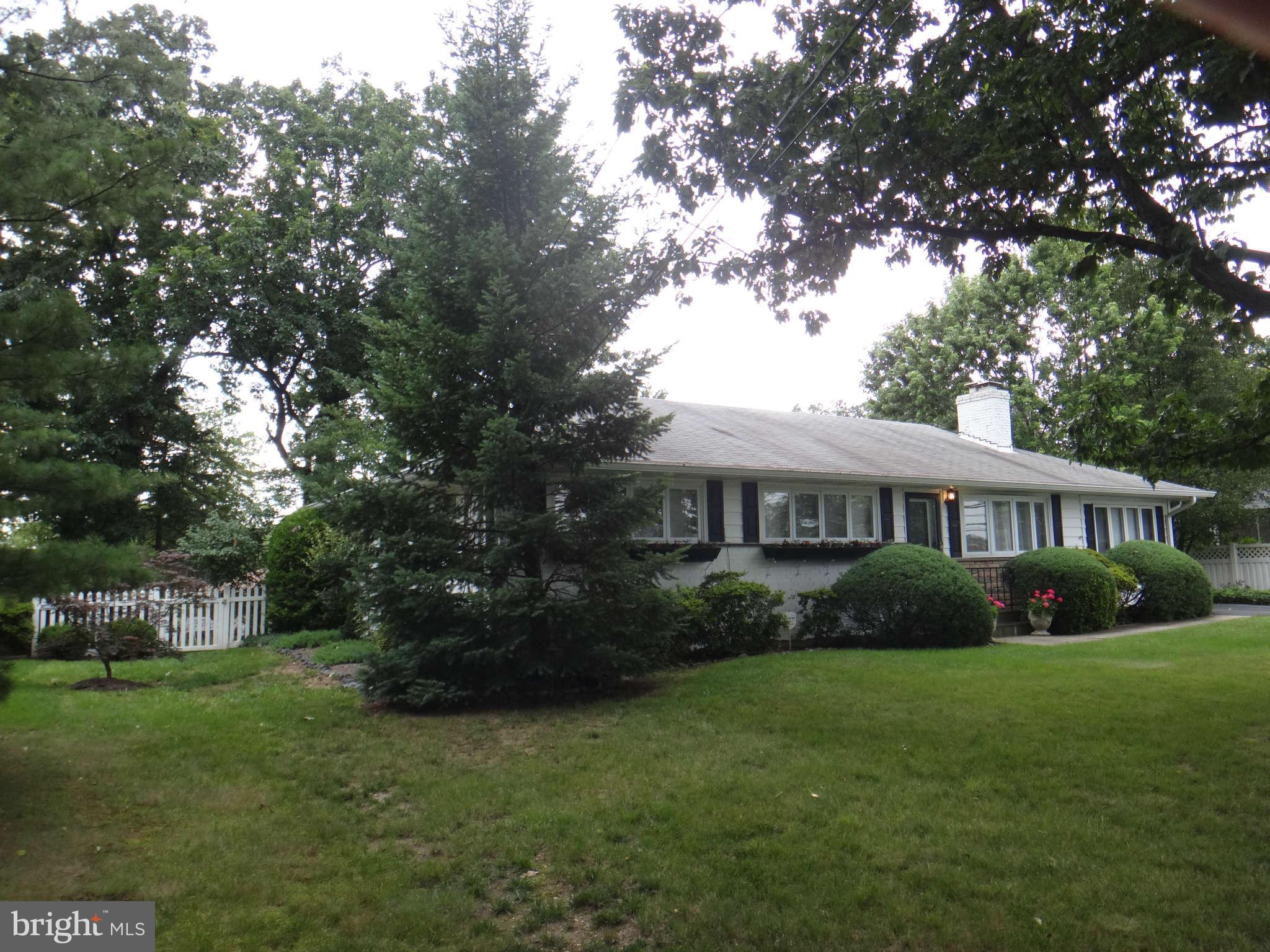10128 Riggs Road Adelphi, MD 20783 - Photo 3 of 30 a front view of a house with garden