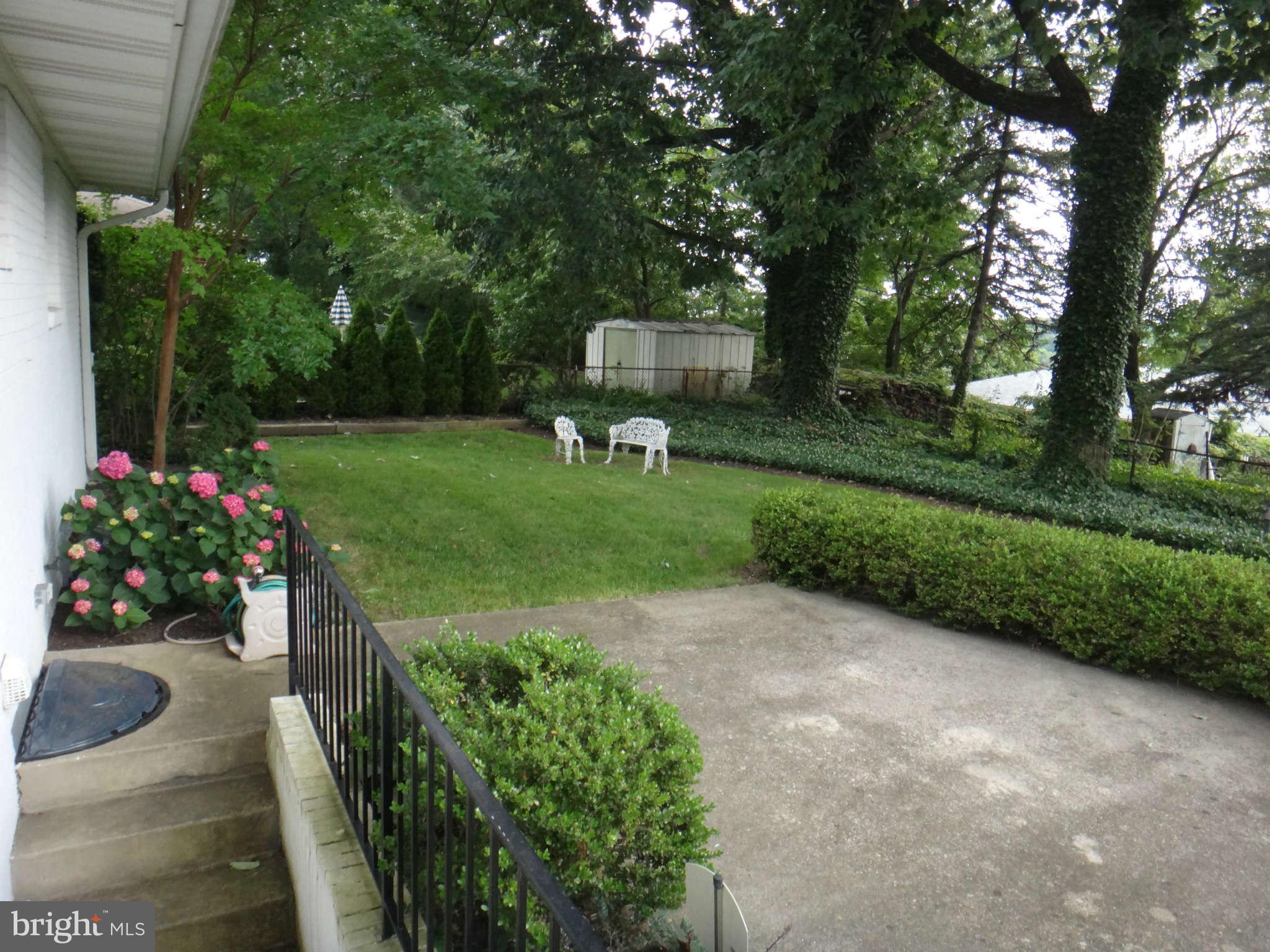 10128 Riggs Road Adelphi, MD 20783 - Photo 30 of 30 a view of a garden with plants and trees