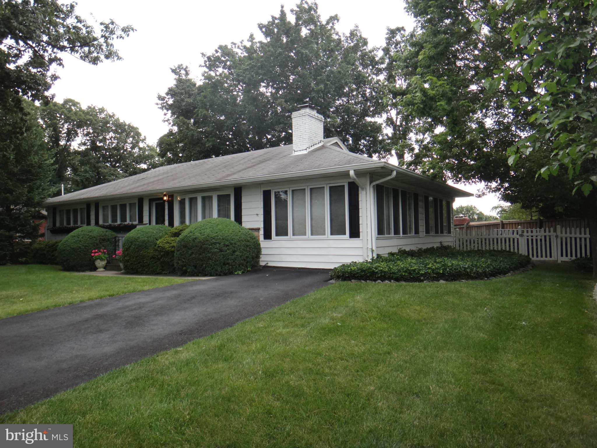 10128 Riggs Road Adelphi, MD 20783 - Photo 4 of 30 a view of a house with a yard