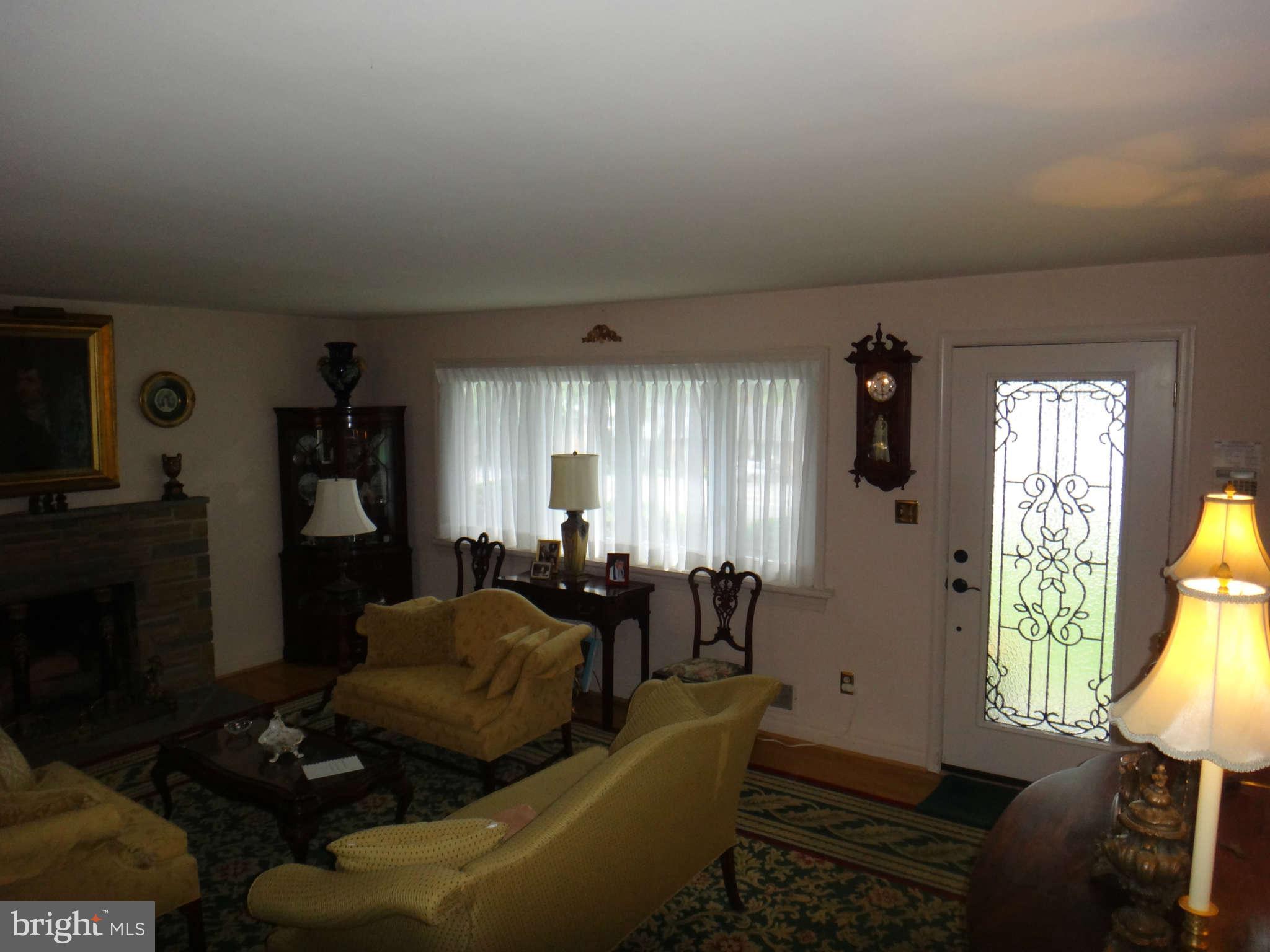 10128 Riggs Road Adelphi, MD 20783 - Photo 8 of 30 a living room with furniture and a window
