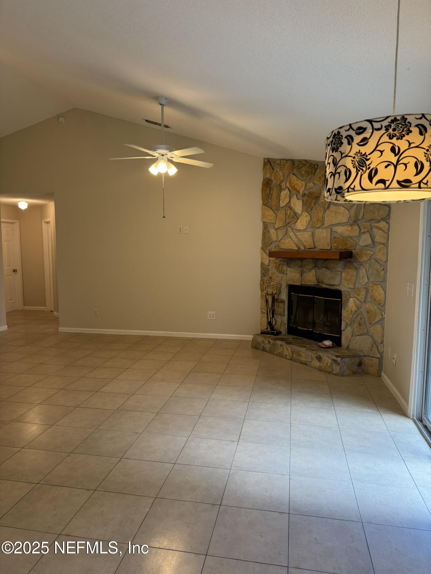 84042 St James Court Yulee, FL 32097 - Photo 12 of 44 a view of an empty room with a fireplace
