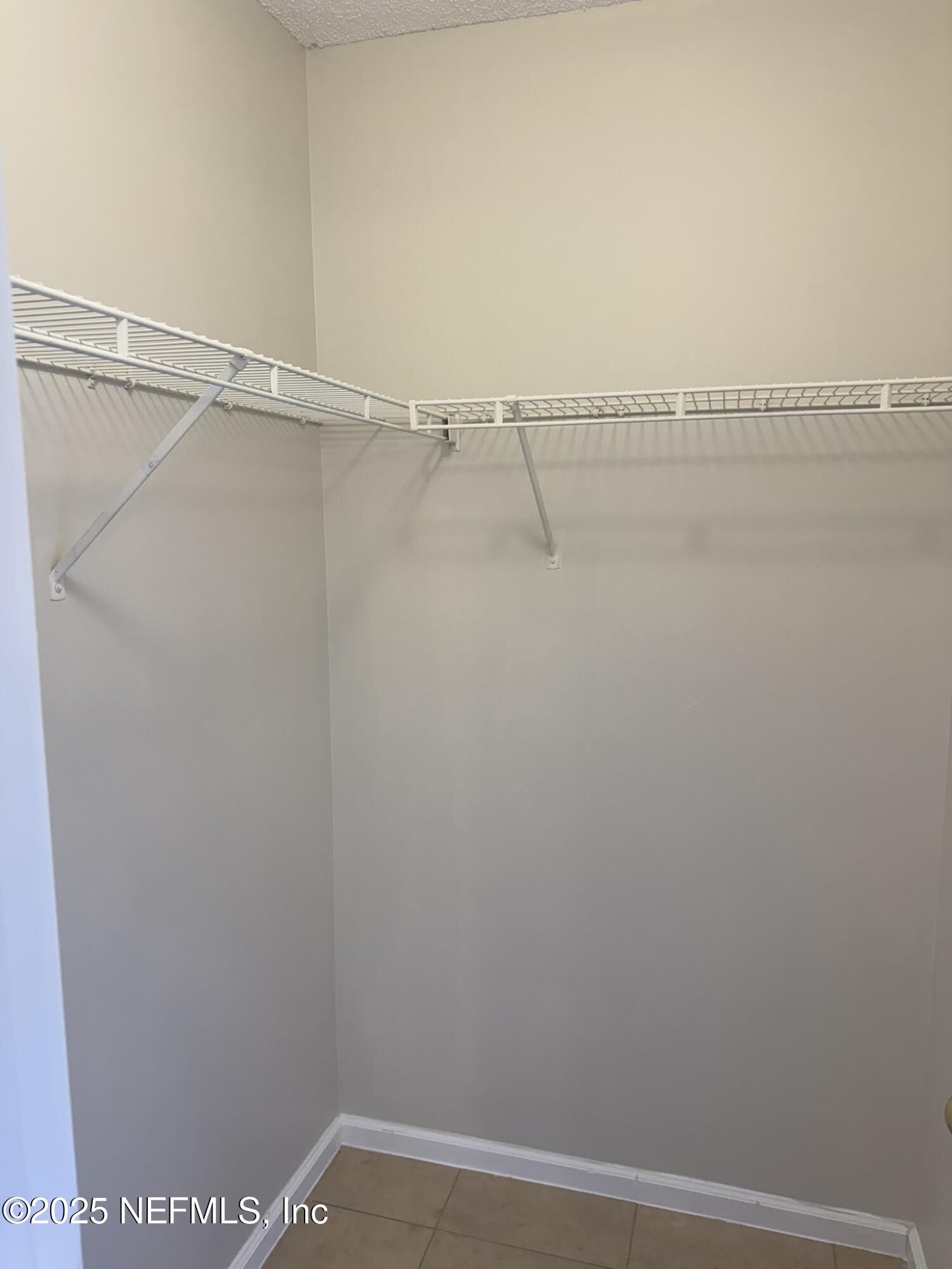 84042 St James Court Yulee, FL 32097 - Photo 17 of 44 a view of small space with racks on the wall