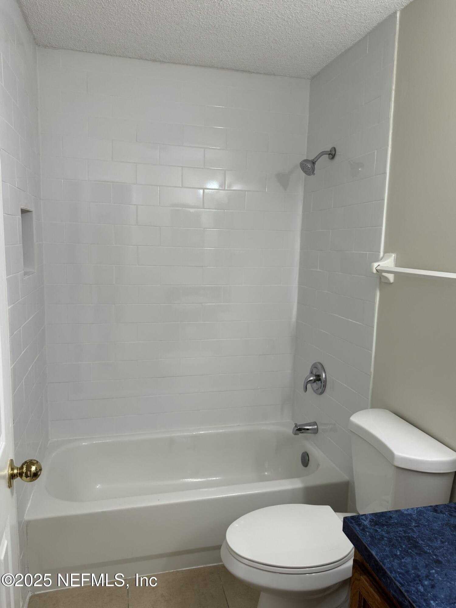 84042 St James Court Yulee, FL 32097 - Photo 22 of 44 a bathroom with a toilet and shower