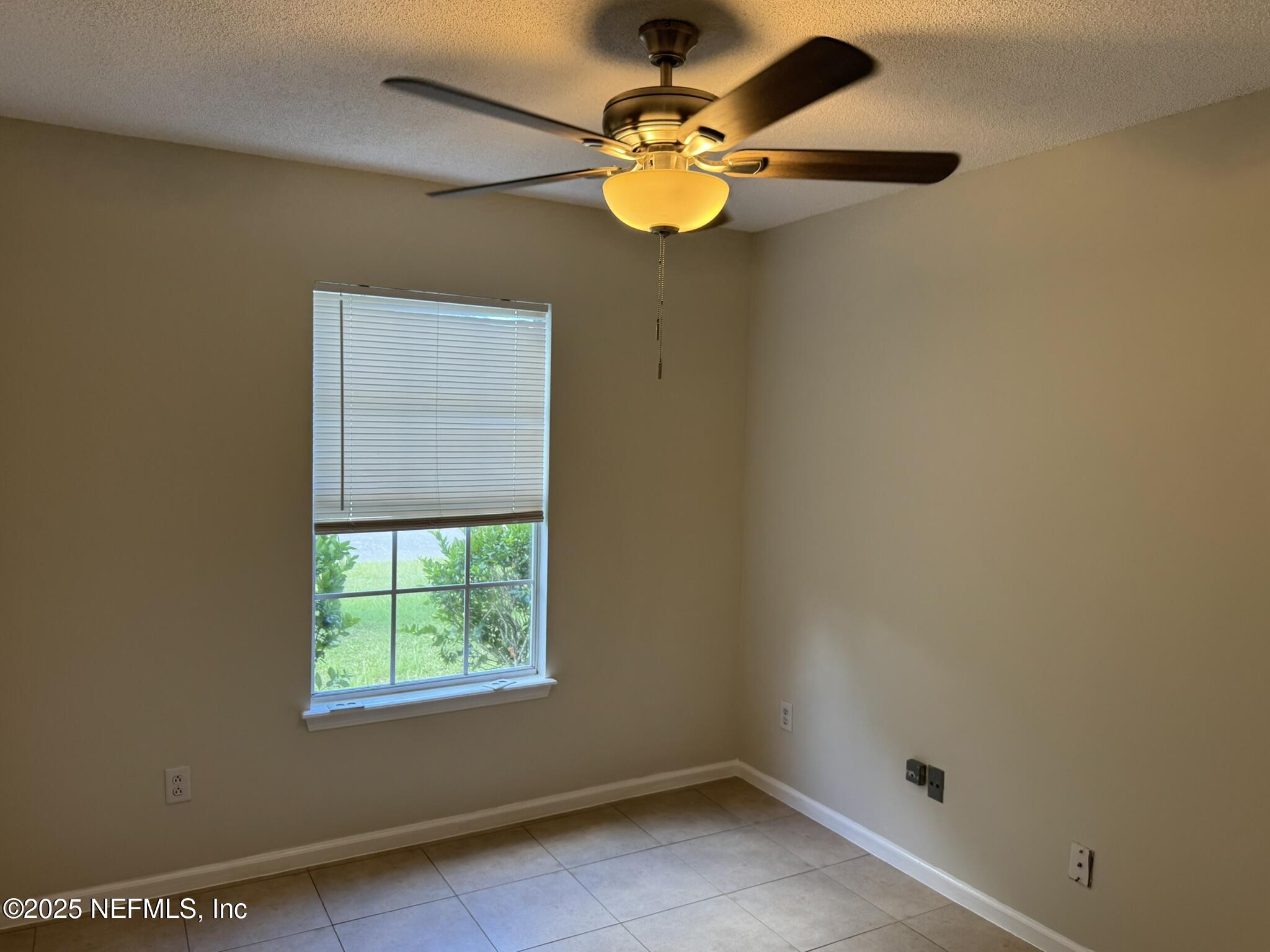 84042 St James Court Yulee, FL 32097 - Photo 24 of 44 an empty room with a window
