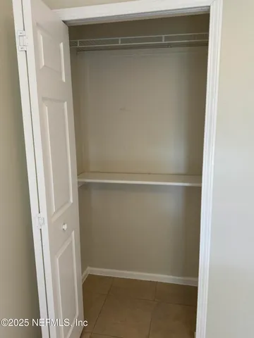 a view of a hallway with closet area