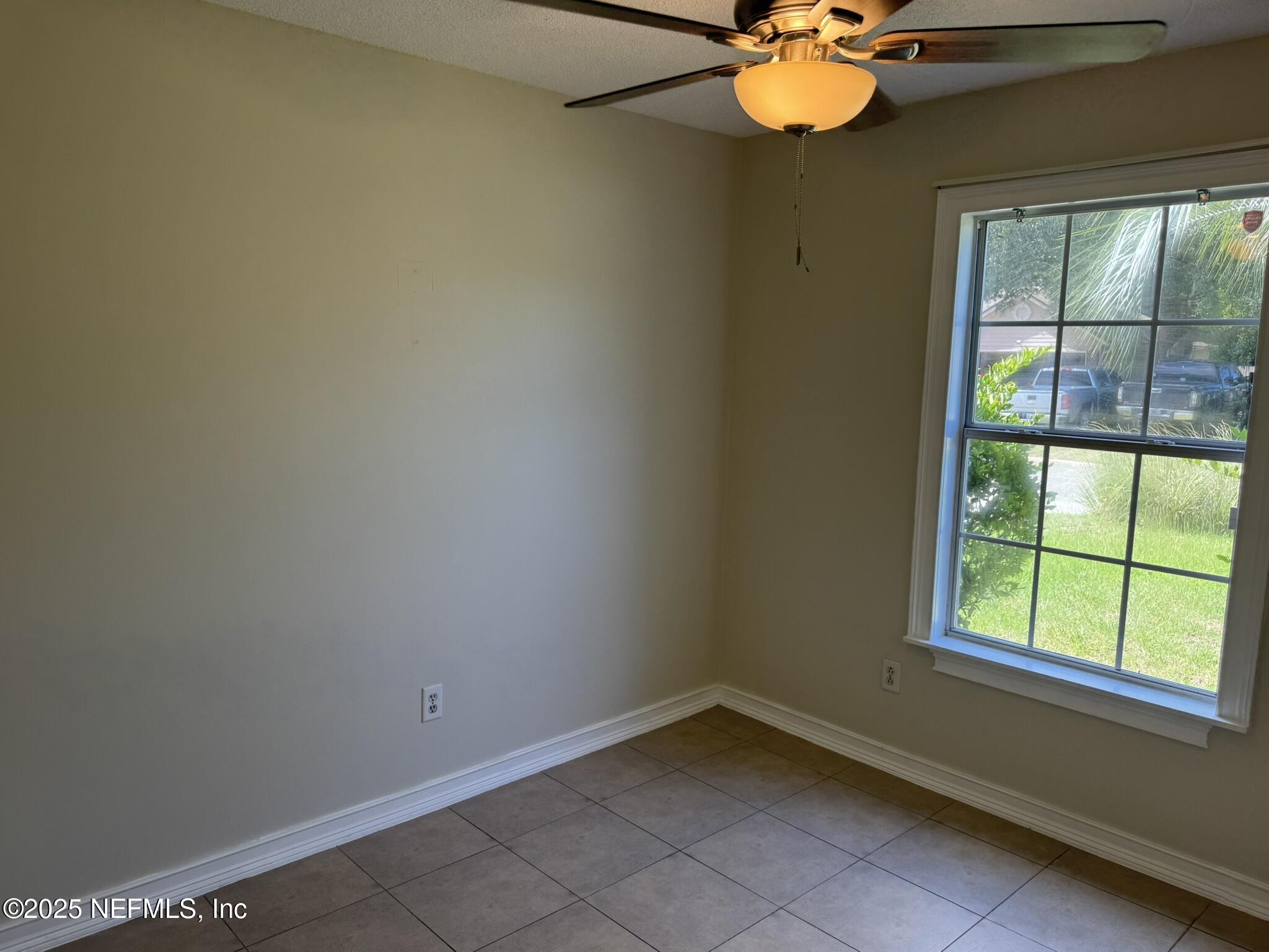 84042 St James Court Yulee, FL 32097 - Photo 28 of 44 an empty room with a window