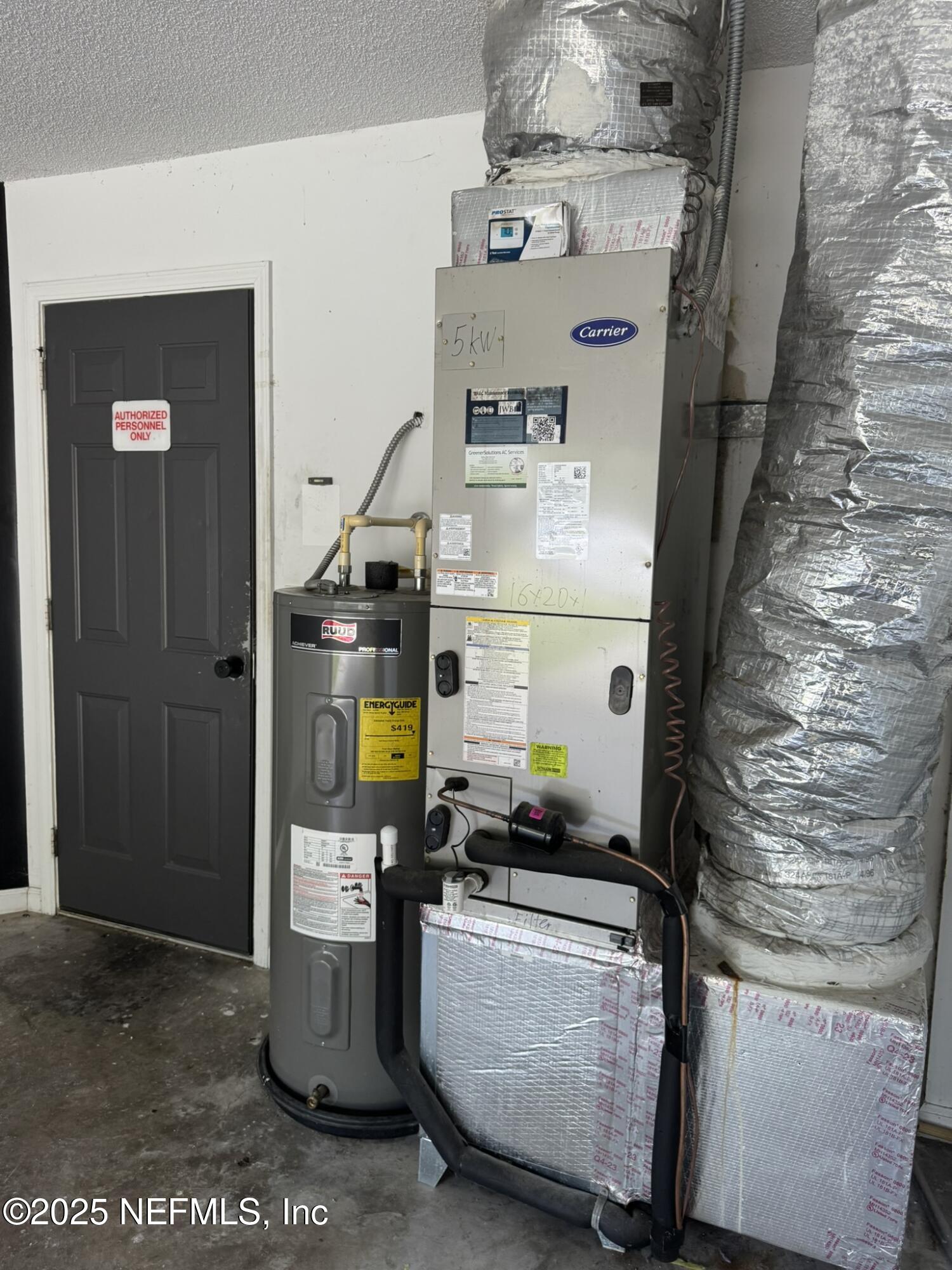 84042 St James Court Yulee, FL 32097 - Photo 35 of 44 a storage room with washer and dryer