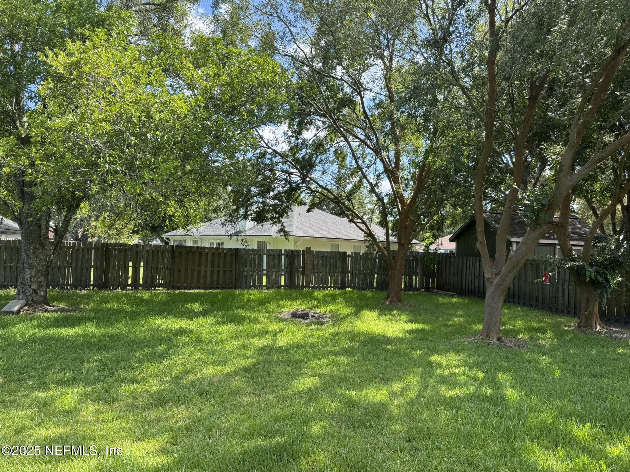 84042 St James Court Yulee, FL 32097 - Photo 36 of 44 a front view of house with a yard and trees