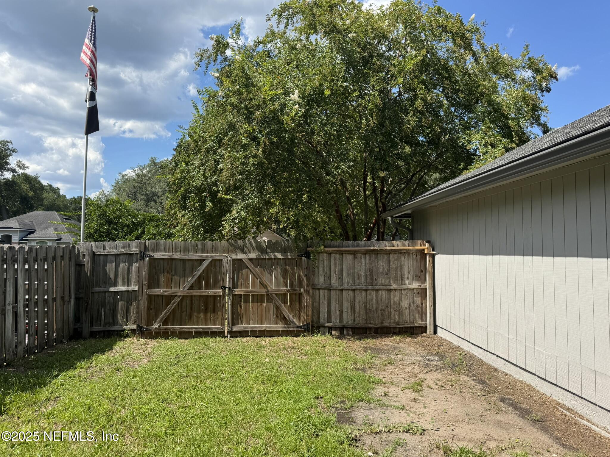 84042 St James Court Yulee, FL 32097 - Photo 38 of 44 a backyard of a house with lots of green space