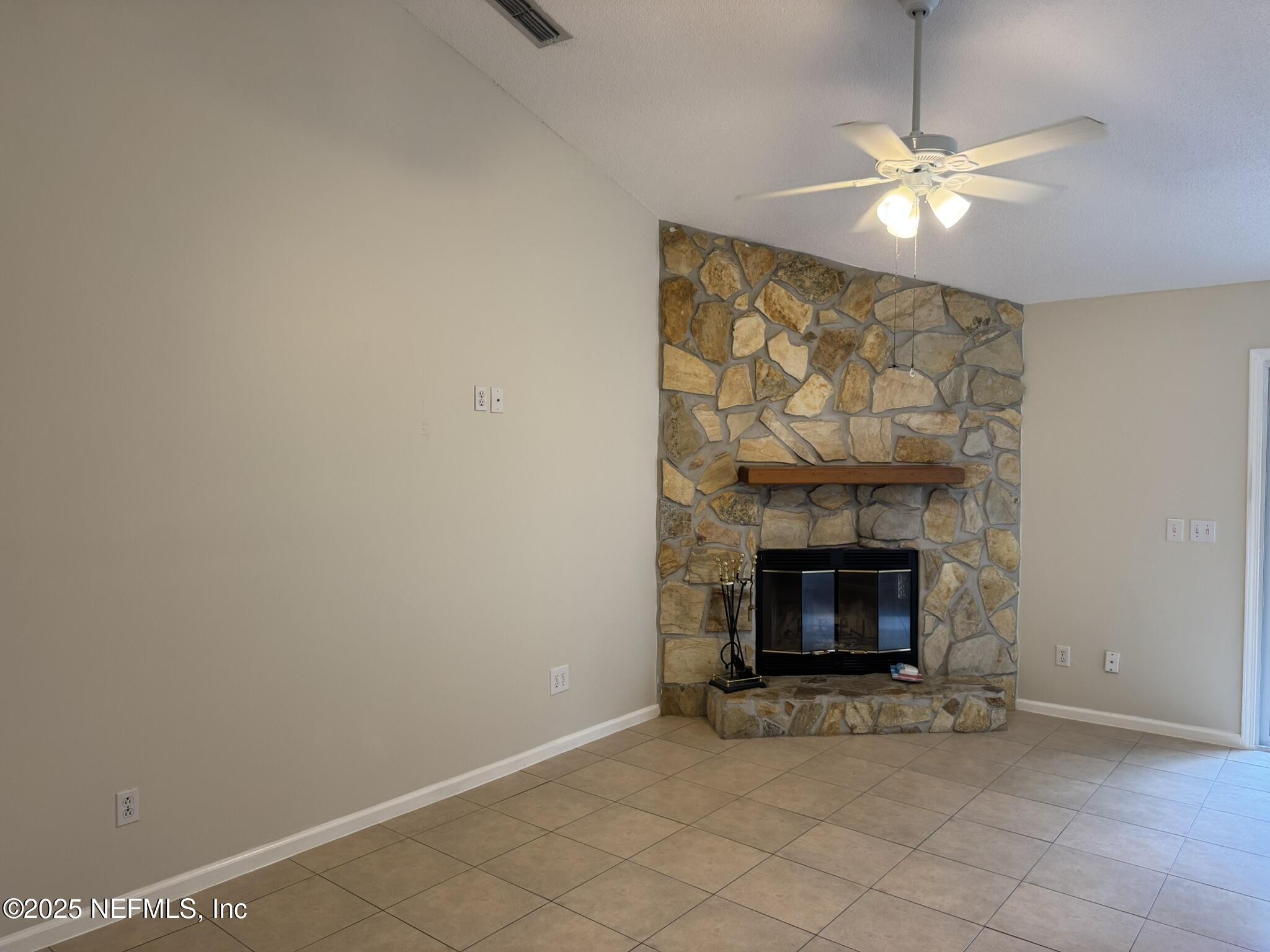 84042 St James Court Yulee, FL 32097 - Photo 8 of 44 a living room with furniture and a fireplace
