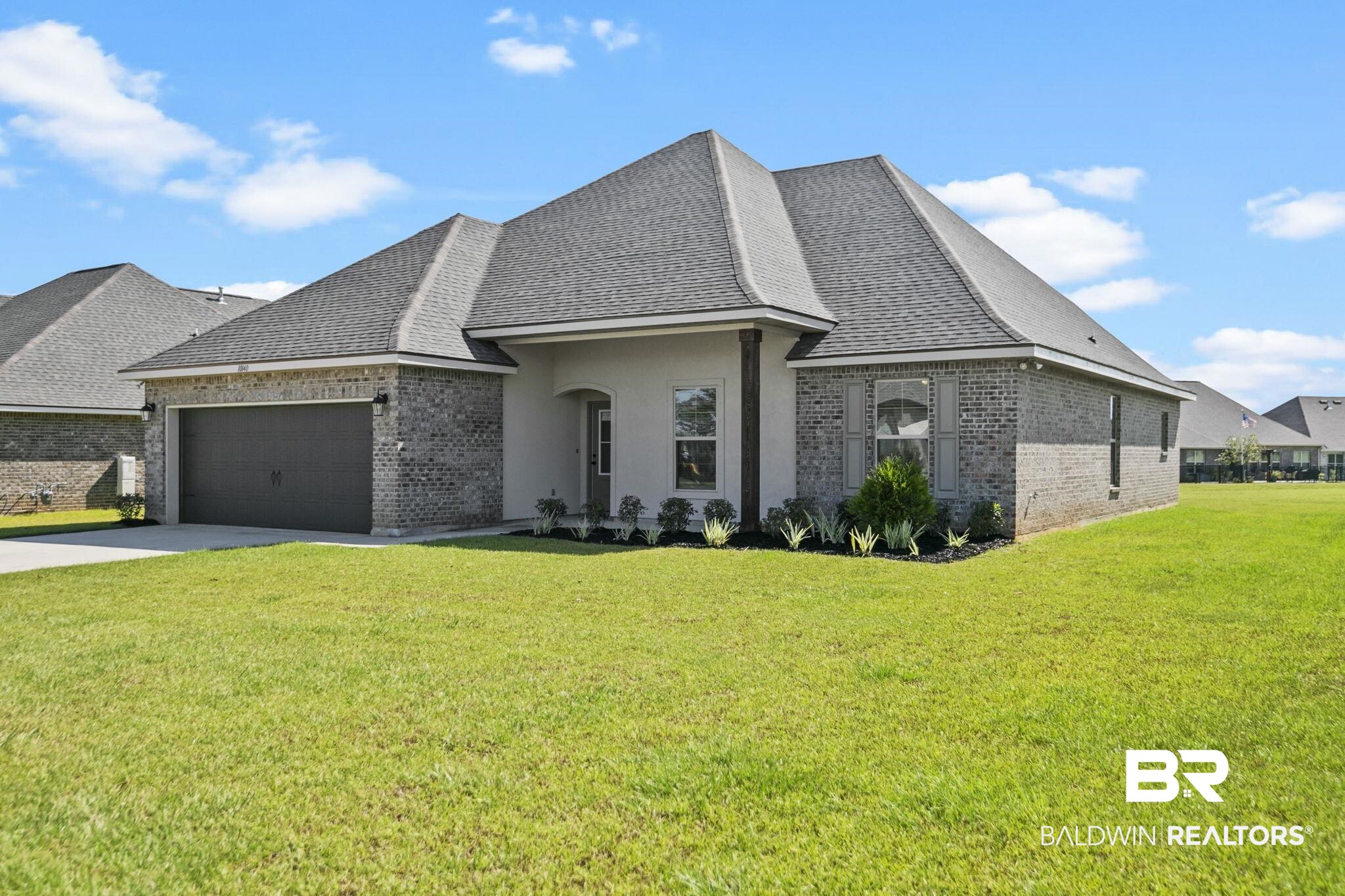 10140 Chipper Lane Foley, AL 36535 - Photo 4 of 72 French country home with a front lawn and a garage