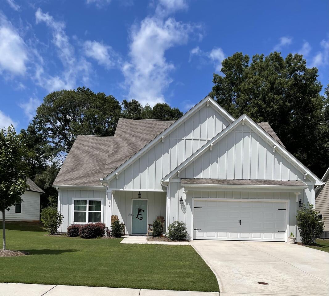 120 S Ridge Senoia, GA 30276 - Photo 1 of 1 a view of a white house next to a yard with big trees