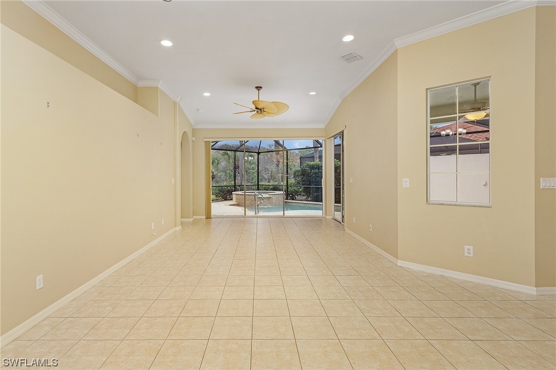 10321 Cape Roman Road, Unit 102 Estero, FL 34135 - Photo 12 of 33 a view of a hallway with wooden floor and a living room