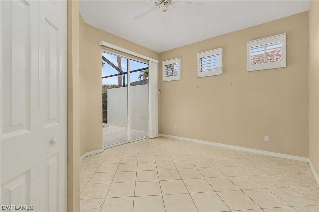 10321 Cape Roman Road, Unit 102 Estero, FL 34135 - Photo 14 of 33 a view of an empty room with a window