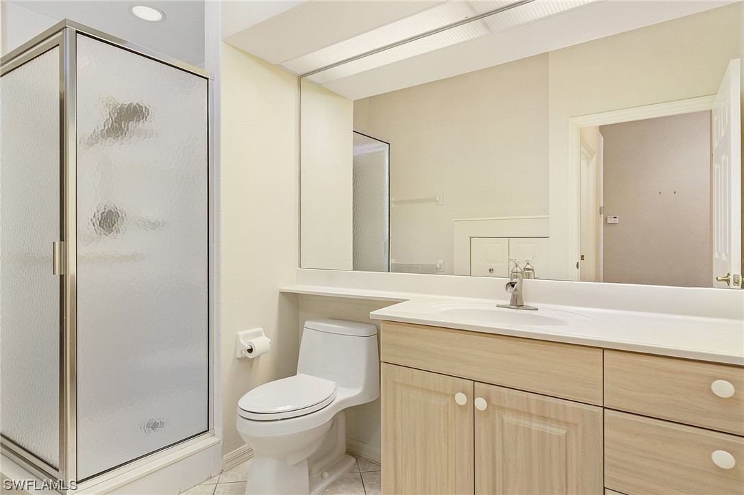 10321 Cape Roman Road, Unit 102 Estero, FL 34135 - Photo 20 of 33 a bathroom with a sink a toilet and shower