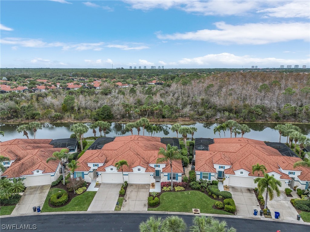 10321 Cape Roman Road, Unit 102 Estero, FL 34135 - Photo 2 of 33 an aerial view of multiple house