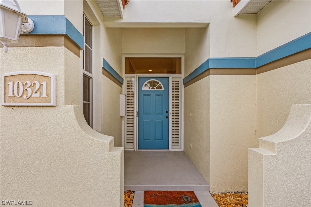 10321 Cape Roman Road, Unit 102 Estero, FL 34135 - Photo 24 of 33 a view of an entryway door