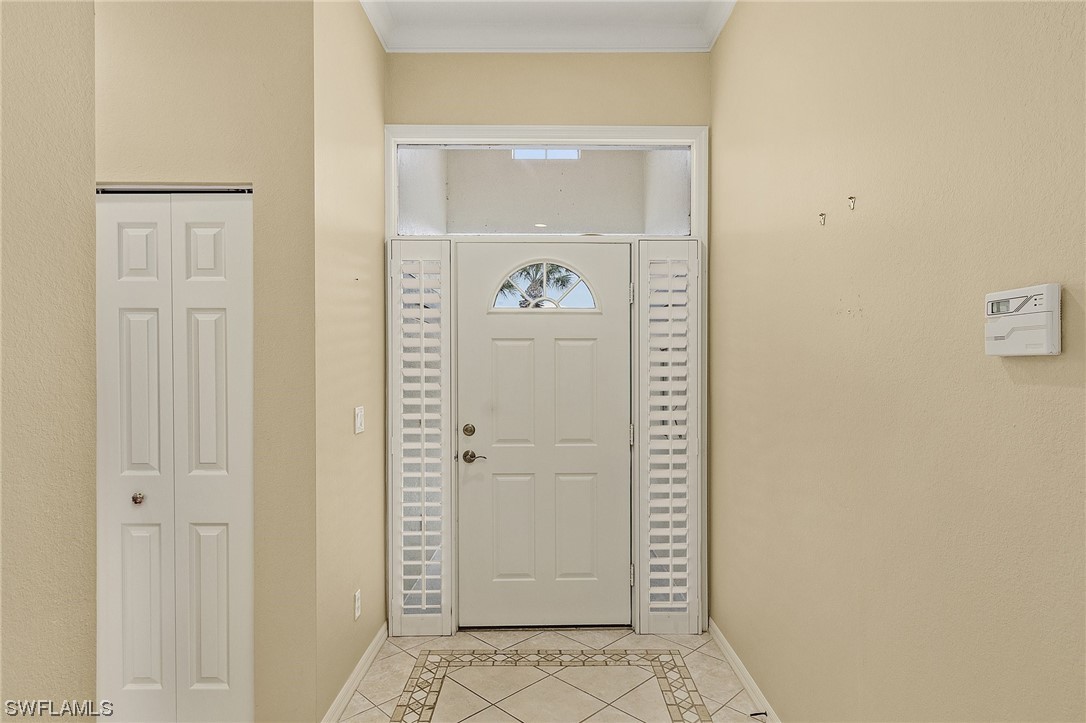 10321 Cape Roman Road, Unit 102 Estero, FL 34135 - Photo 25 of 33 a view of hallway with wooden floor
