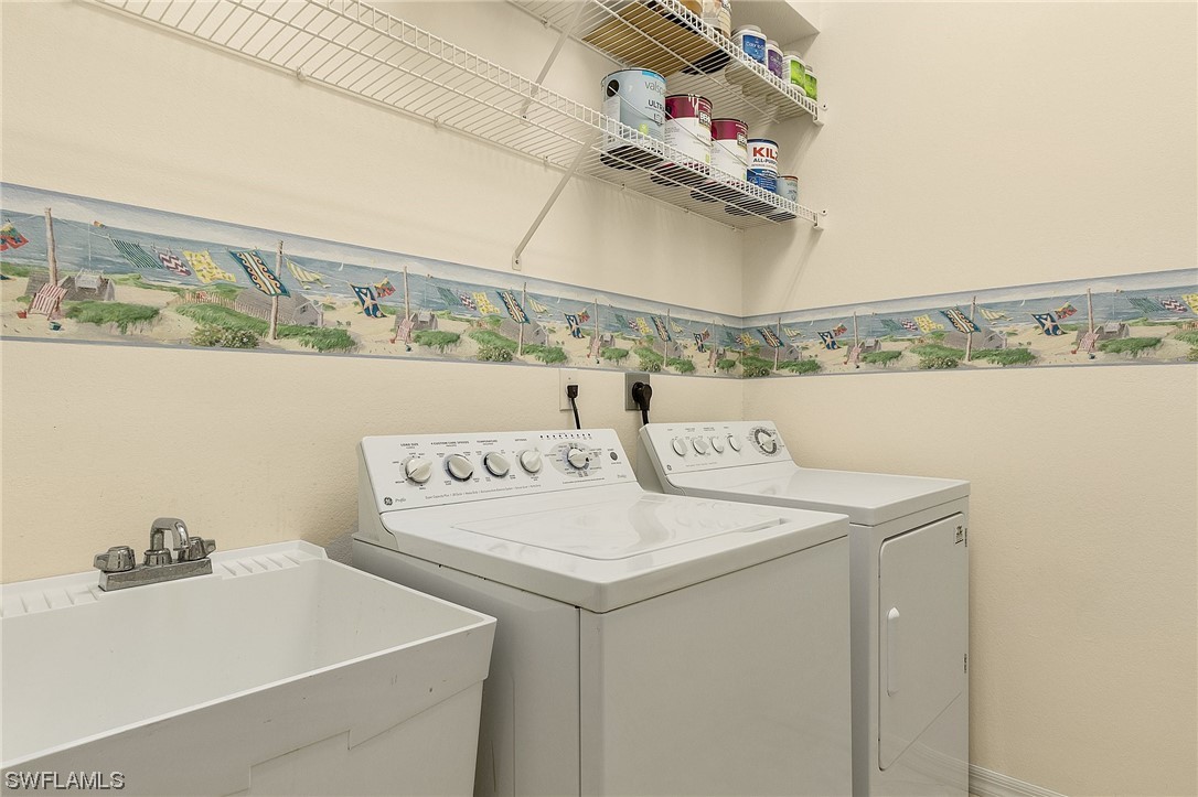 10321 Cape Roman Road, Unit 102 Estero, FL 34135 - Photo 26 of 33 a utility room with dryer and washer