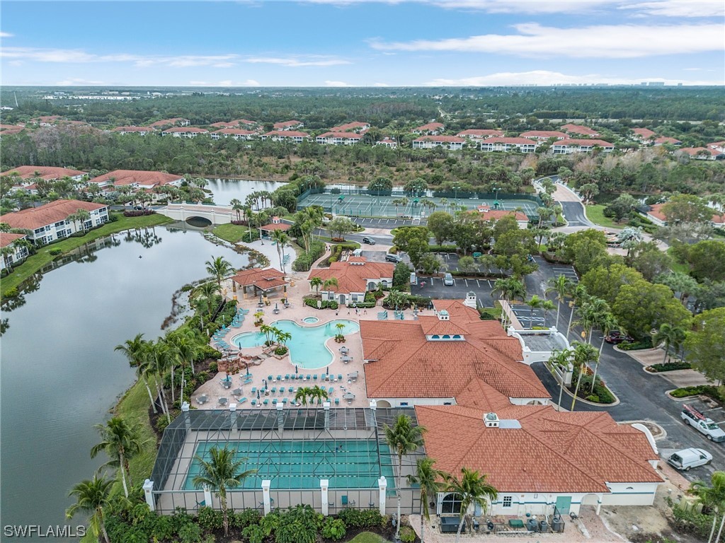 10321 Cape Roman Road, Unit 102 Estero, FL 34135 - Photo 29 of 33 an aerial view of residential houses with outdoor space