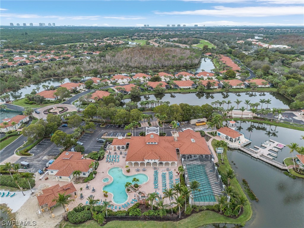 10321 Cape Roman Road, Unit 102 Estero, FL 34135 - Photo 30 of 33 an aerial view of residential houses with outdoor space