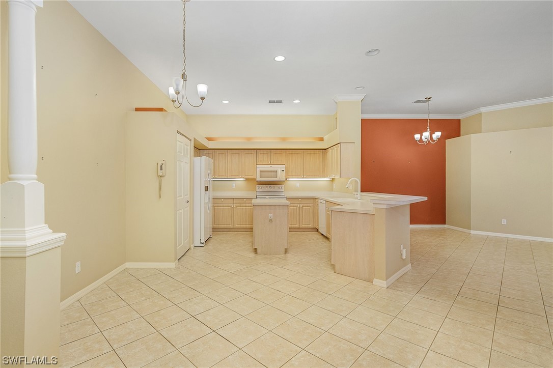 10321 Cape Roman Road, Unit 102 Estero, FL 34135 - Photo 8 of 33 a view of a kitchen with a sink