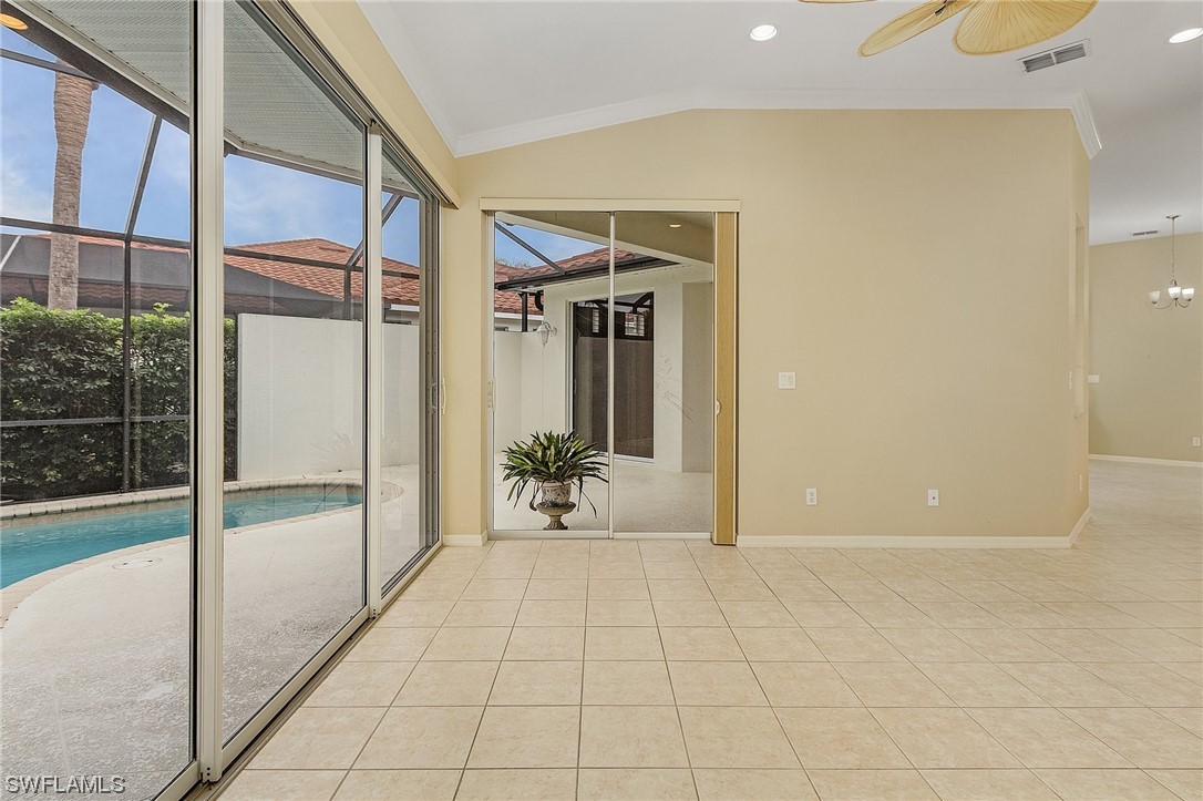10321 Cape Roman Road, Unit 102 Estero, FL 34135 - Photo 10 of 33 a view of an entryway with a glass door