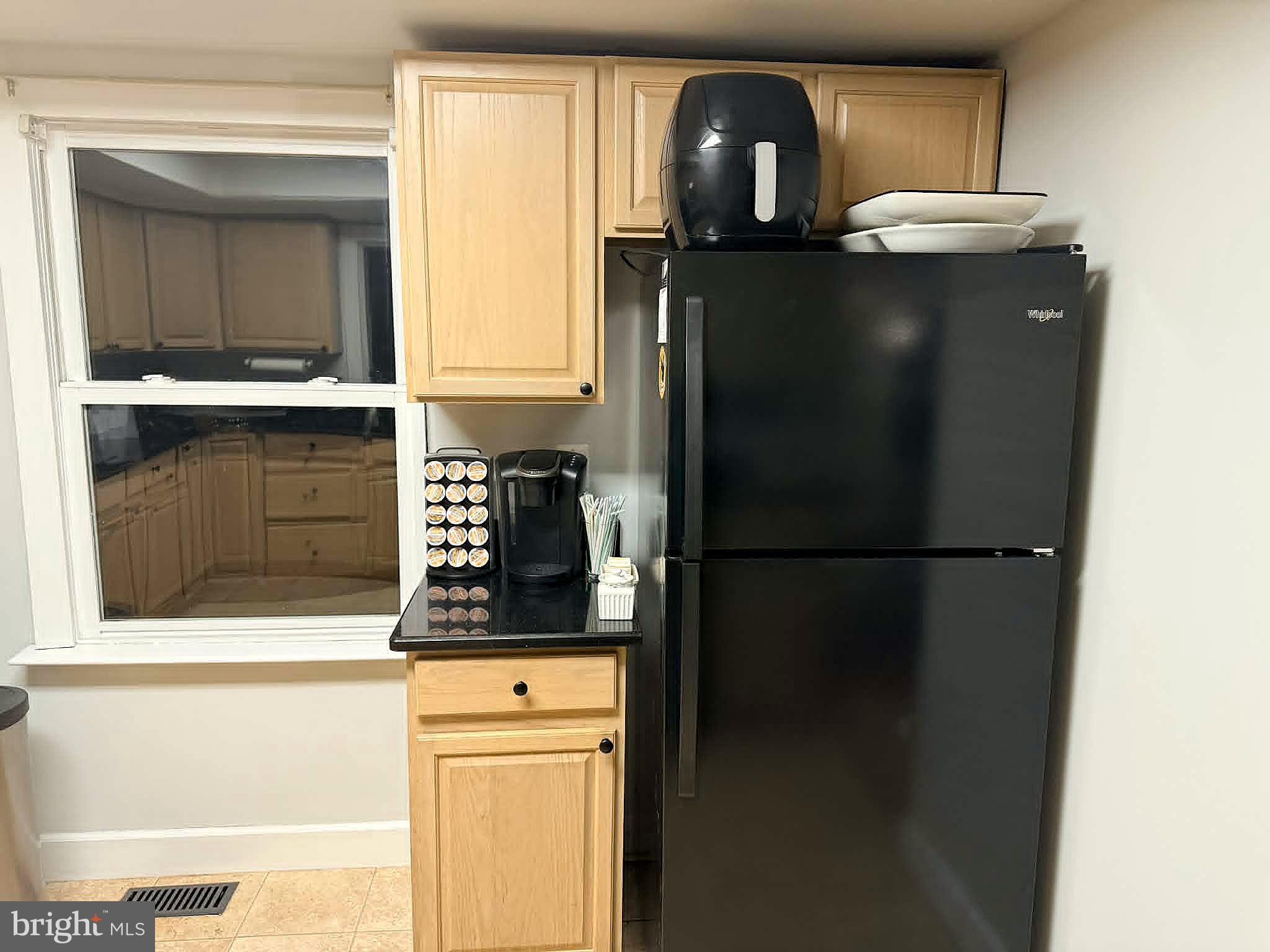 17155 Hudson Mill Road Culpeper, VA 22701 - Photo 23 of 39 a kitchen with a refrigerator and cabinets