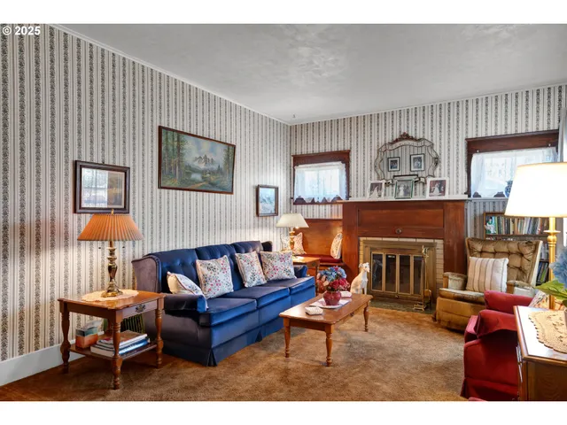 a living room with furniture windows and a flat screen tv