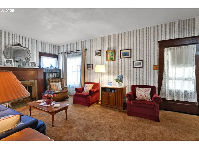 a view of living room kitchen and entryway