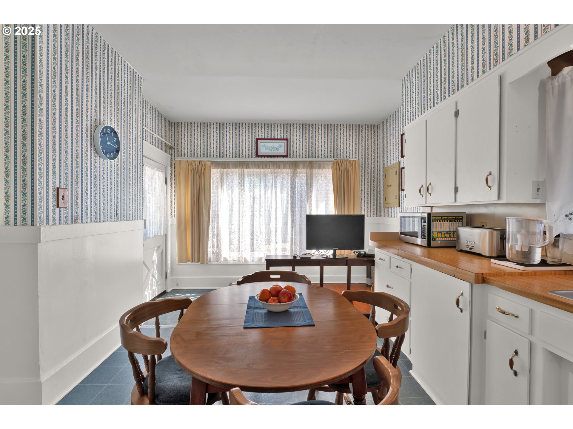 834 Southwest 9th Avenue Albany, OR 97321 - Photo 22 of 48 a kitchen with stainless steel appliances kitchen island granite countertop a sink a stove a dining table and chairs