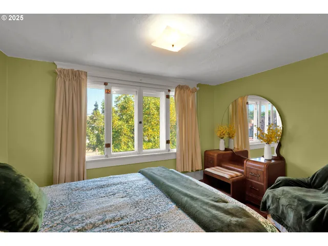 a bedroom with a bed and dresser