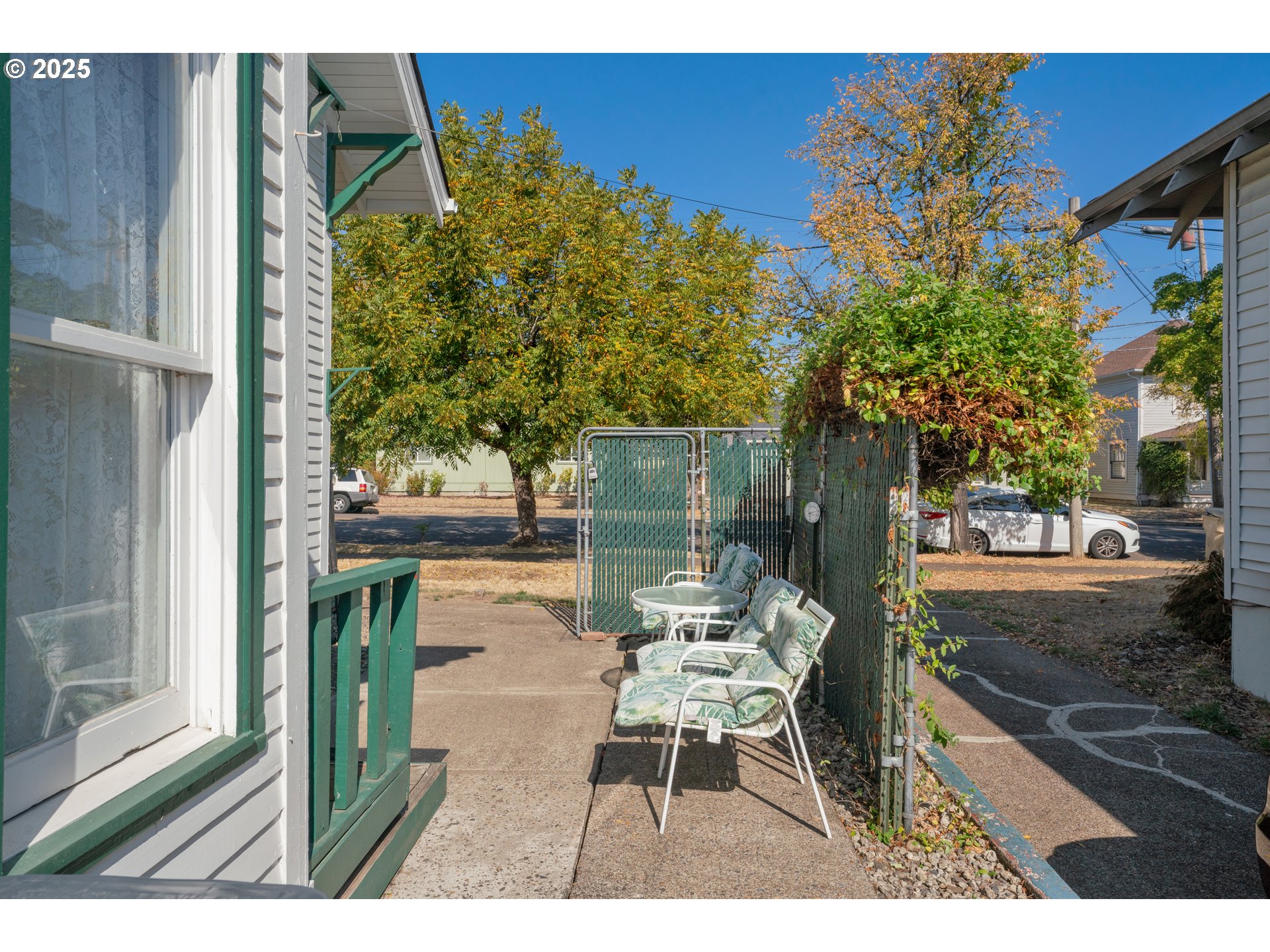 834 Southwest 9th Avenue Albany, OR 97321 - Photo 10 of 48 a balcony with table and chairs and potted plants