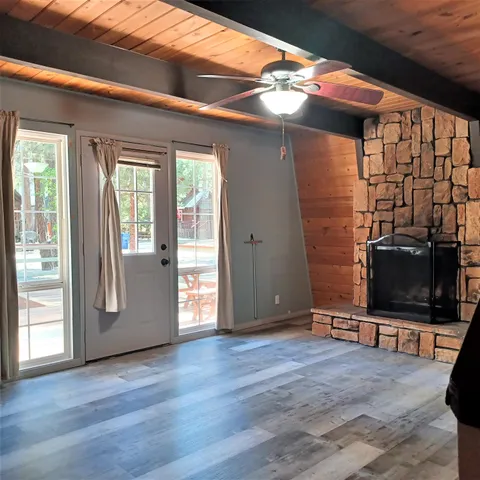 a view of a livingroom with furniture and a flat screen tv