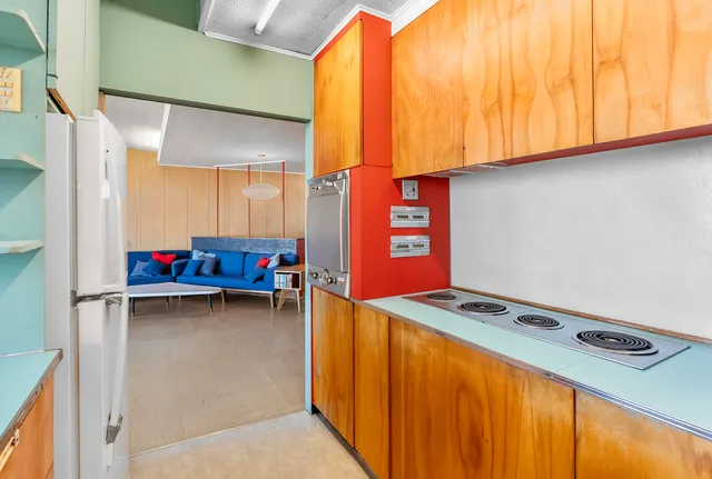 a view of room with window and furniture