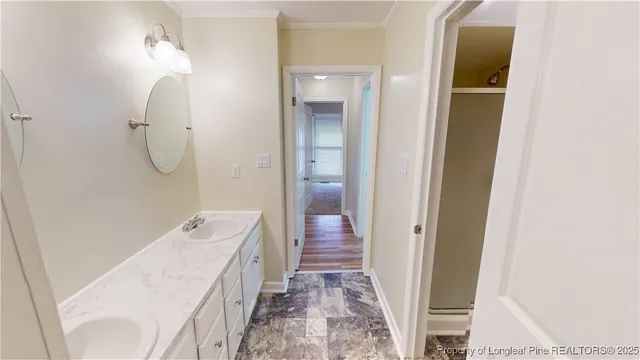 a bathroom with a tub sink and mirror