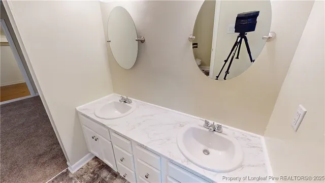 a bathroom with a sink and mirror