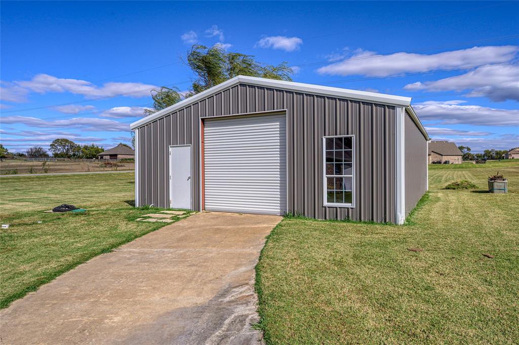 10264 Farmington Road Van Alstyne, TX 75495 - Photo 29 of 39 a front view of a house with a yard