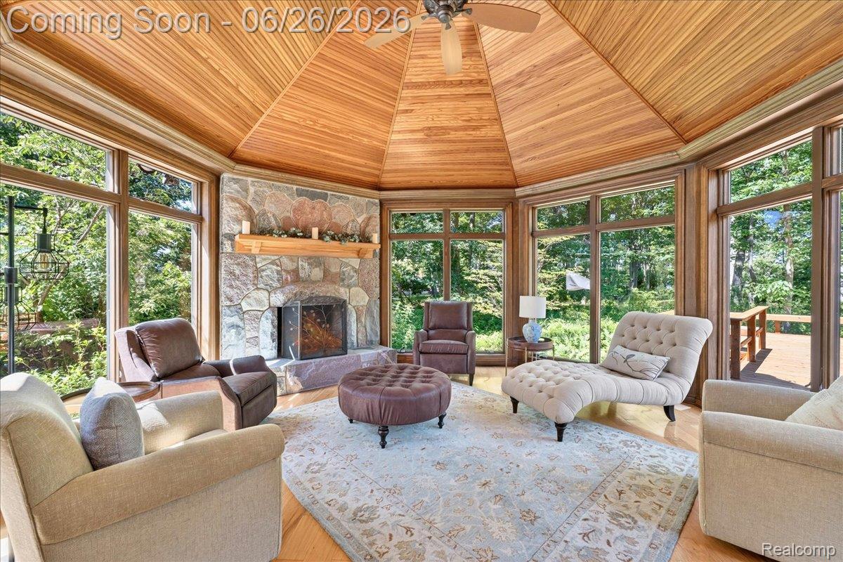 29498 East River Road Grosse Ile, MI 48138 - Photo 25 of 66 Family Room with Hand Split Stone from Charlevoix and Mantel from a GI Tree