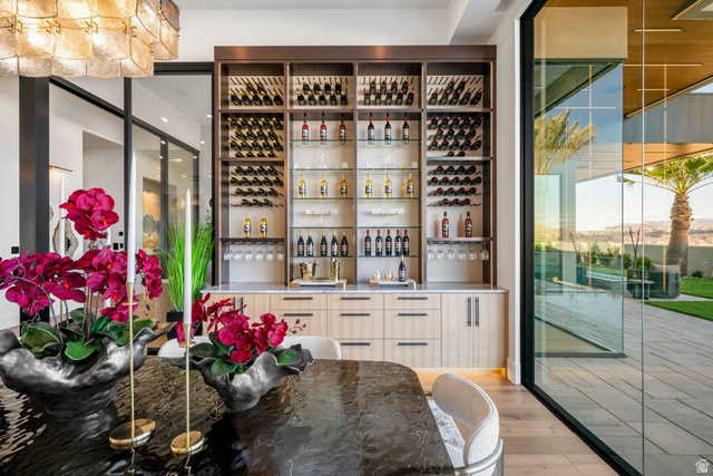 2867 East Granite Way St. George, UT 84790 - Photo 13 of 69 Built-in bar with extensive wine storage, integrated stemware racks, and a light-toned countertop