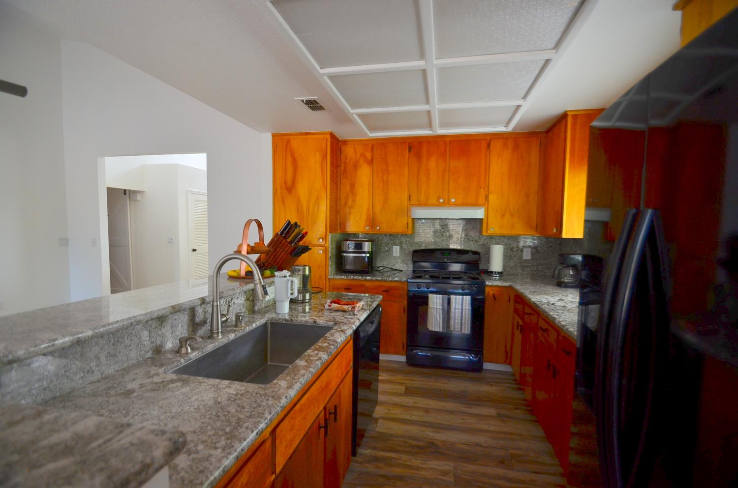 243 Rio Mesa Court Galt, CA 95632 - Photo 19 of 47 Granite counters, gas stove, pull-out, pretty birch cabinets, deep island sink