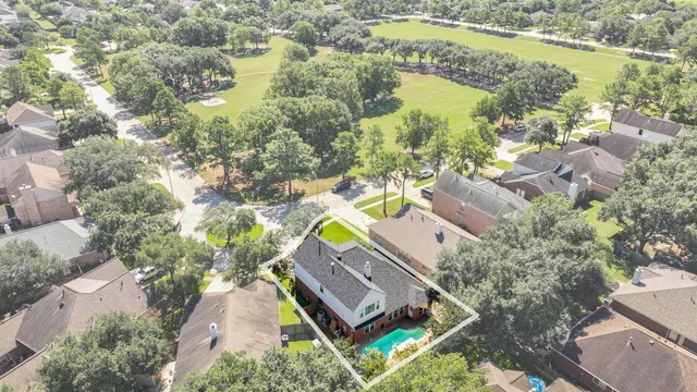 an aerial view of a house with a lake view