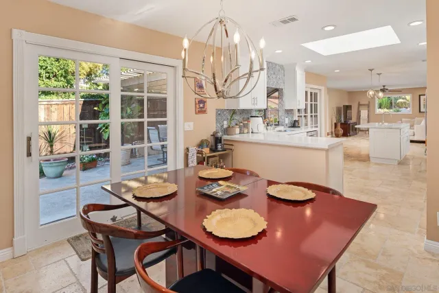 a kitchen with a sink refrigerator and cabinets
