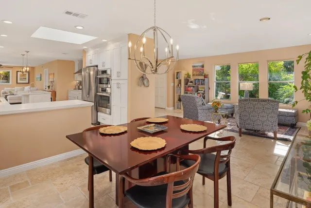 a kitchen with cabinets and stainless steel appliances