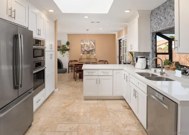 a view of walk in closet and window