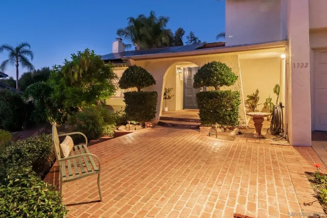 a living room with furniture gym equipment and a view of kitchen