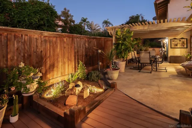 an aerial view of a house with a yard swimming pool and outdoor seating